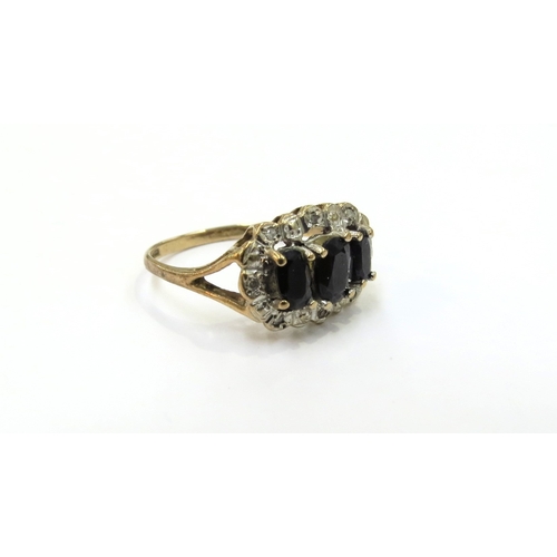 9120 - A 9ct gold sapphire and diamond chip cluster ring. Size N, 2.3g