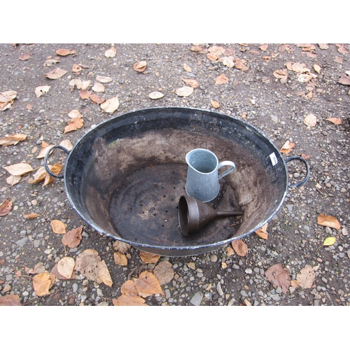 3504 - A twin handled galvanised bath, a galvanised jug and a funnel