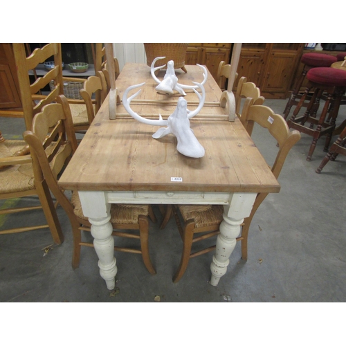 1089 - A Victorian style pine scrub top table with single end cutlery drawer over turned and tapering legs,... 