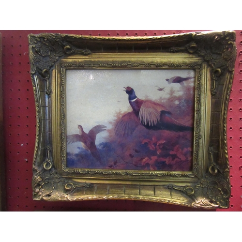 1029 - Two gilt-framed oleographs of pheasants in flight, 19cm x 24cm image sizes