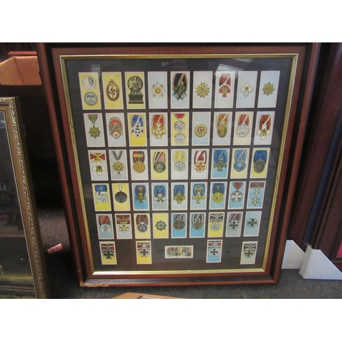 1037 - Three framed displays of various cigarette cards, militaria related themes