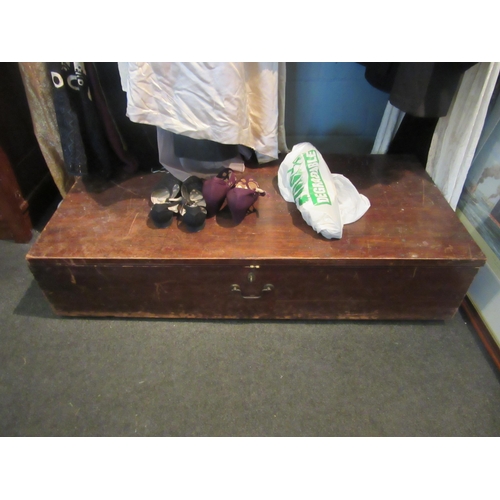 1059 - A ply trunk containing a good quantity of clothing, mainly women's including Victorian pieces, early... 