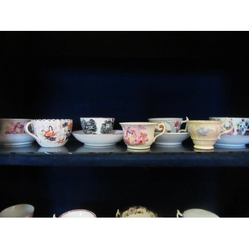 1069 - A selection of mostly early 19th Century and later cups and saucers, hand painted and transfer print... 