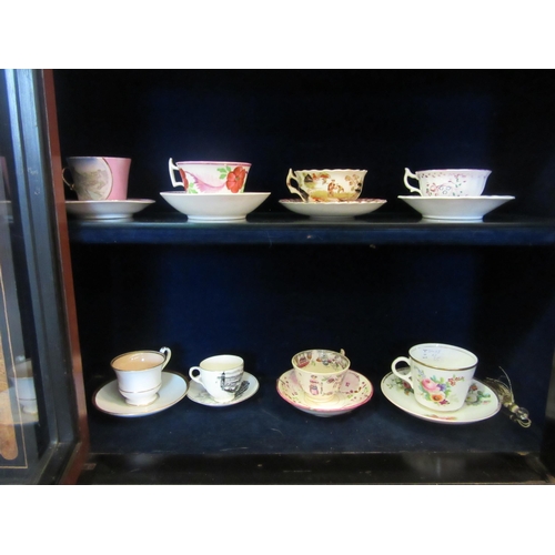 1069 - A selection of mostly early 19th Century and later cups and saucers, hand painted and transfer print... 