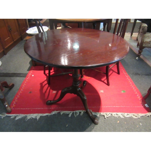 1073 - A Victorian mahogany wine table, turned support to a tripod pad foot base, 75.5cm wide top