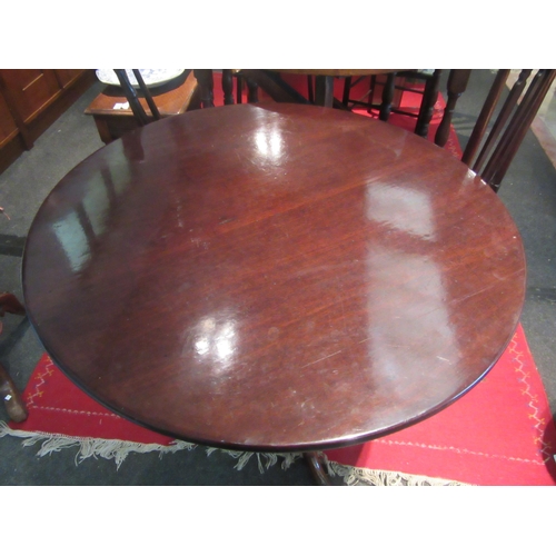 1073 - A Victorian mahogany wine table, turned support to a tripod pad foot base, 75.5cm wide top