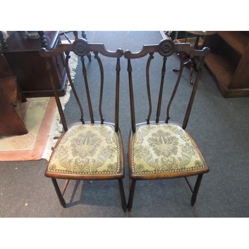 1077 - A pair of mahogany bedroom chairs on 