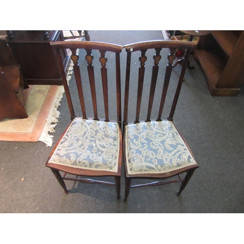 1081 - A pair of Arts & Crafts style bedroom chairs, inlay to back joined by stretchers