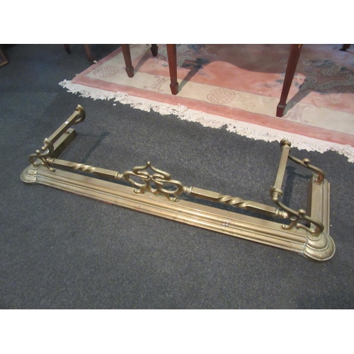 1093 - An Art Nouveau style brass fire fender, approximately 140cm long