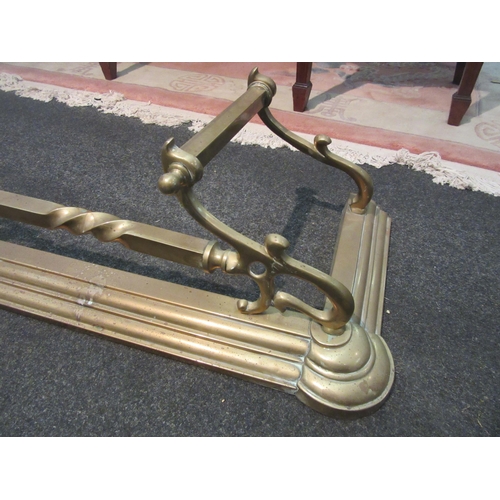 1093 - An Art Nouveau style brass fire fender, approximately 140cm long