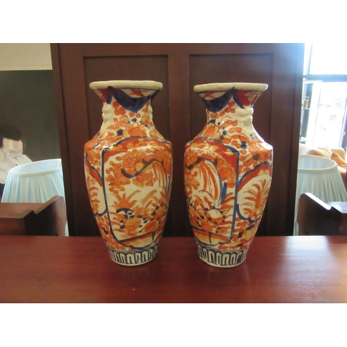 1102 - A pair of 20th Century Japanese Imari baluster form vases, 30cm tall