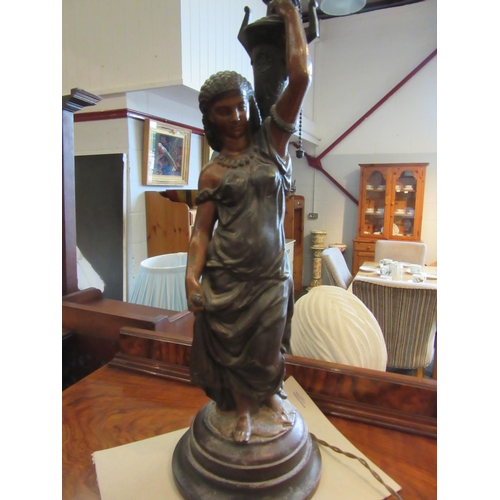 1102A - A spelter figural lamp, lady holding flame shade aloft