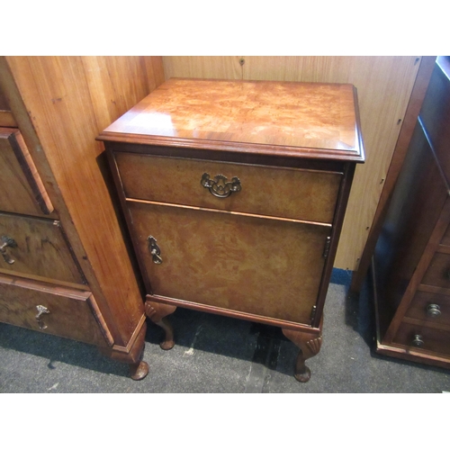 1103 - A 1930's walnut drinks cabinet, two doors over three long drawers, squashed bun feet, 132cm tall x 7... 