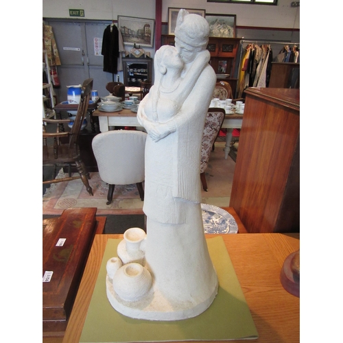 1112 - Two plaster statues of Native Americans, 64cm and 60cm tall, a/f chipped corner to one.