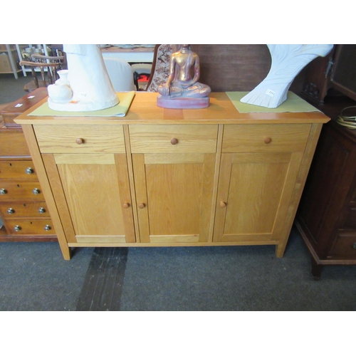 1113 - A John Lewis light oak sideboard, three drawers over three door cupboard, 80cm tall x 124cm long x 4... 