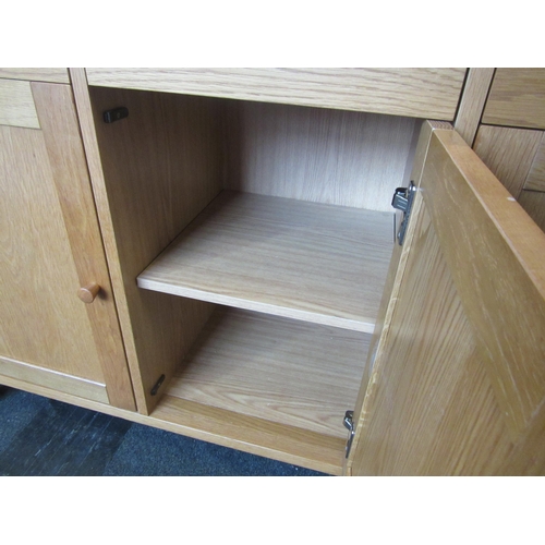 1113 - A John Lewis light oak sideboard, three drawers over three door cupboard, 80cm tall x 124cm long x 4... 