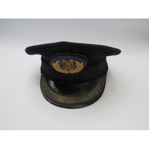 8003 - A station master peaked cap with gilded emblem to front