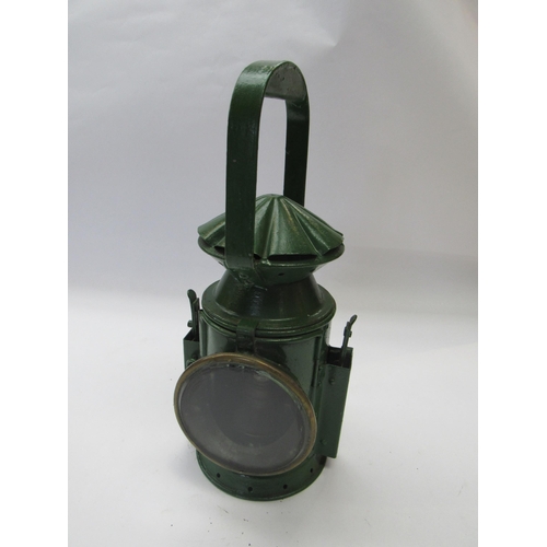 8035 - A three aspect army issue hand lamp with reservoir and burner interior, side plaque missing