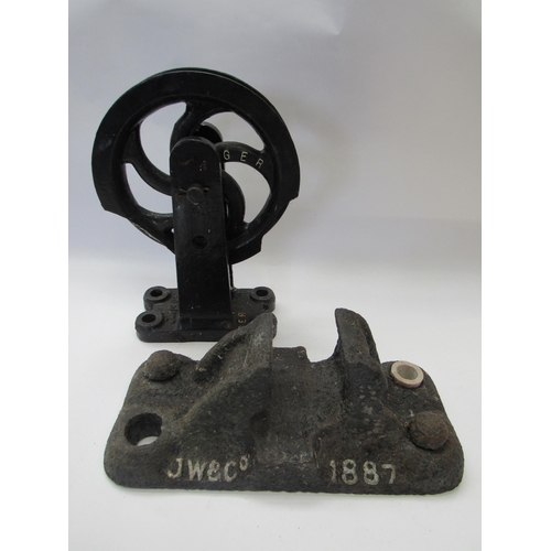 8065 - A cast iron GER rail chair dated 1887 and a similar GER signal lineside wire guide wheel a/f