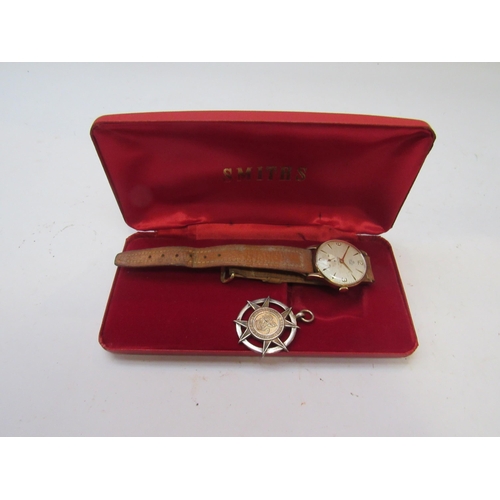 8181 - A 9ct gold cased Smiths wristwatch that was presented to Mr E.Green on his retirement. Engraved to t... 