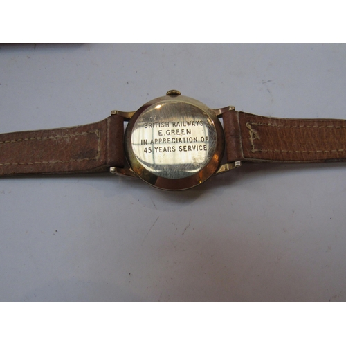 8181 - A 9ct gold cased Smiths wristwatch that was presented to Mr E.Green on his retirement. Engraved to t... 