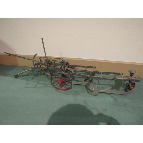 8213 - Three travelling tradesman's model ploughs, two marked Ransomes including PAT No 139054/1919 104cm l... 