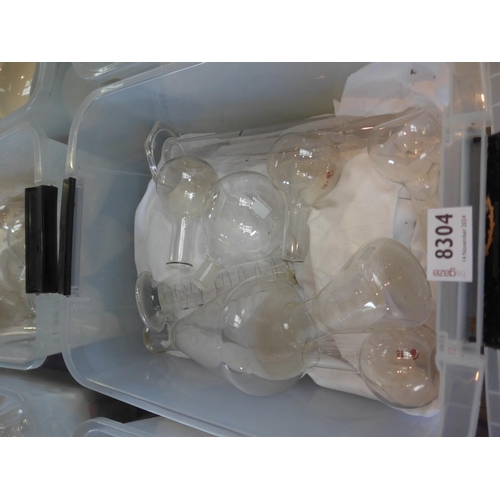 8304 - A box of glass conical and ball shape measuring glasses