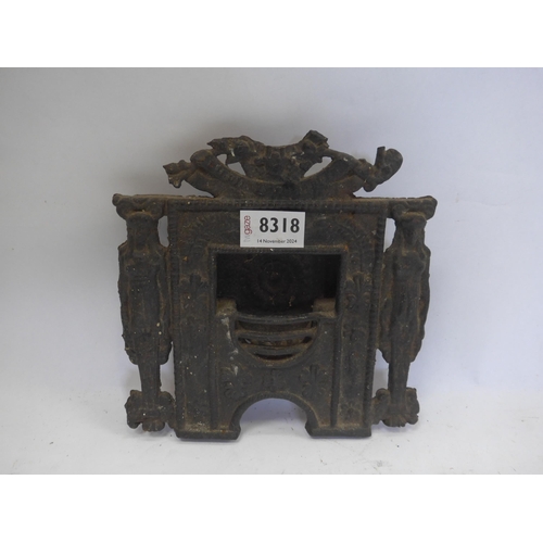 8318 - A cast iron salesmans fireplace, 20cm x 20cm