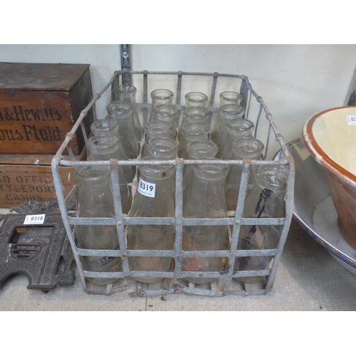 8319 - A galvanised  milk bottle crate and 20 wide neck milk bottles