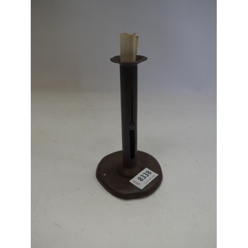 8338 - A tinware hog scraper candlestick with paper provenance