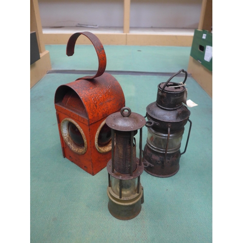 8389 - A road lamp, miners lamp and one other