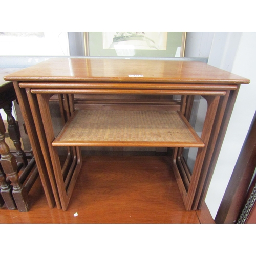 2424 - A 1970's Johannes Anderson teak nest of three tables