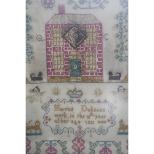 2001 - A framed sampler, 1821, 31cm x 48cm and a framed photograph from Methwold Fete 1913