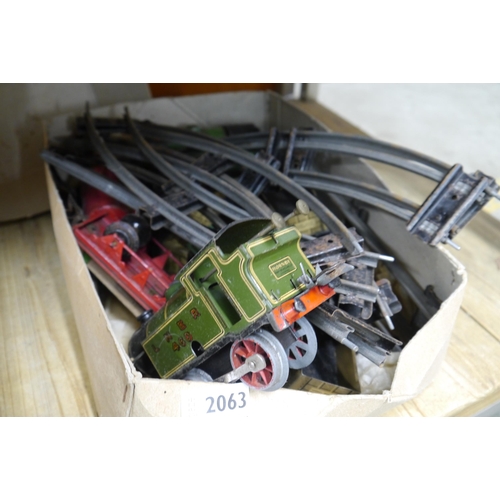 2063 - A box of Hornby railway tracks and trains