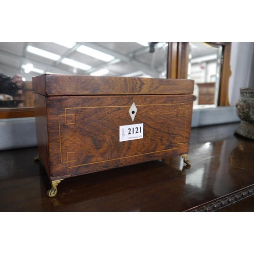 2121 - A Georgian Rosewood tea caddy with brass paw feet