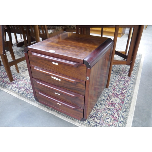 2426 - A small rosewood veneer bedside chest of 4 drawers