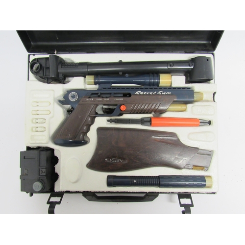 9128A - A De Luxe Topper Toys Secret Sam toy gun spy set in black plastic attache case, c.1965 (unchecked fo... 