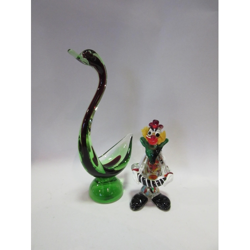 1537 - An art glass swan, clear bleeding into red green, together with a Murano glass clown (2)