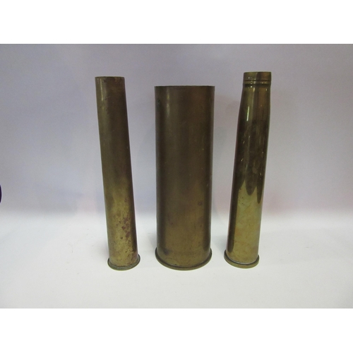 1546 - Three brass shell cases