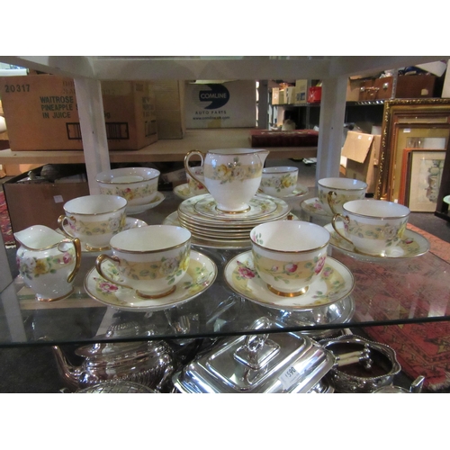 1589 - A Royal Doulton 'Rosamund' part tea set comprising of teacups and saucers, milk jug etc.