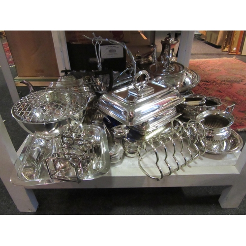 1590 - A good selection of silver plated items to include an asparagus serving tray entree dishes tea and c... 