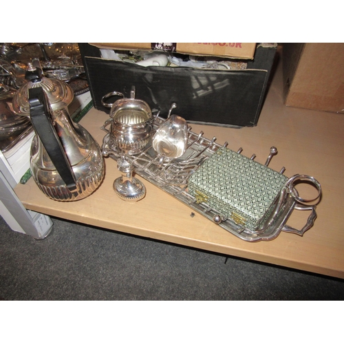 1590 - A good selection of silver plated items to include an asparagus serving tray entree dishes tea and c... 