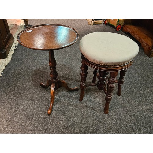 1085 - A 1920's oak occasional table together with a swivel-top piano stool (2)