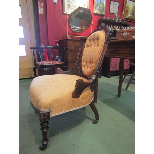 4015 - A Victorian style button back armchair with carved decoration