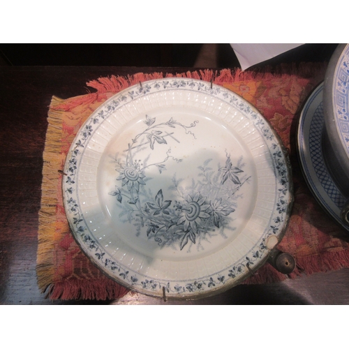 4212 - A 19th Century sectional blue and white ceramic warming plate, footed base, and three further exampl... 