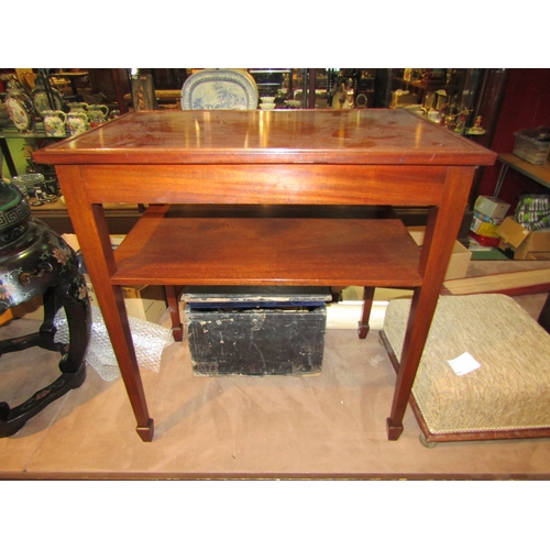 4248 - In the manner of Bevan & Funnell a mahogany two-tier lamp table on square tapering legs and spade fe... 