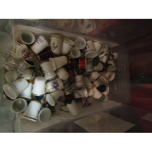 4256 - A large collection of thimbles along with wooden display shelves