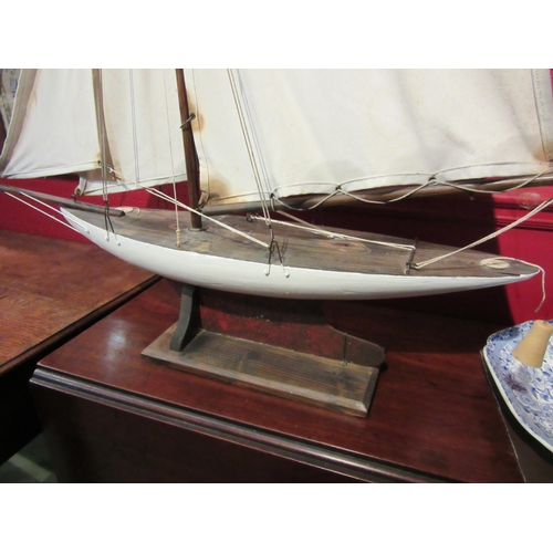 4080 - A model yacht on stand, 94cm tall