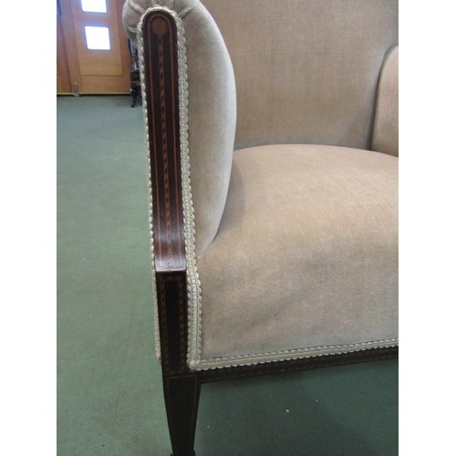 4109 - An Edwardian mahogany armchair with chequer strung inlay over square tapering fore legs on brass cas... 