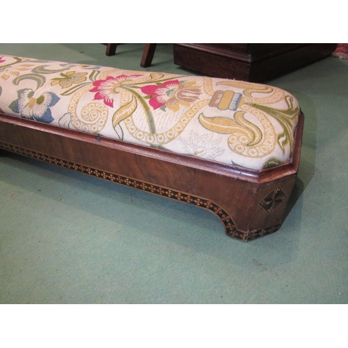 4170 - A 19th Century walnut marquetry fireside footstool with later upholstery, 125cm long